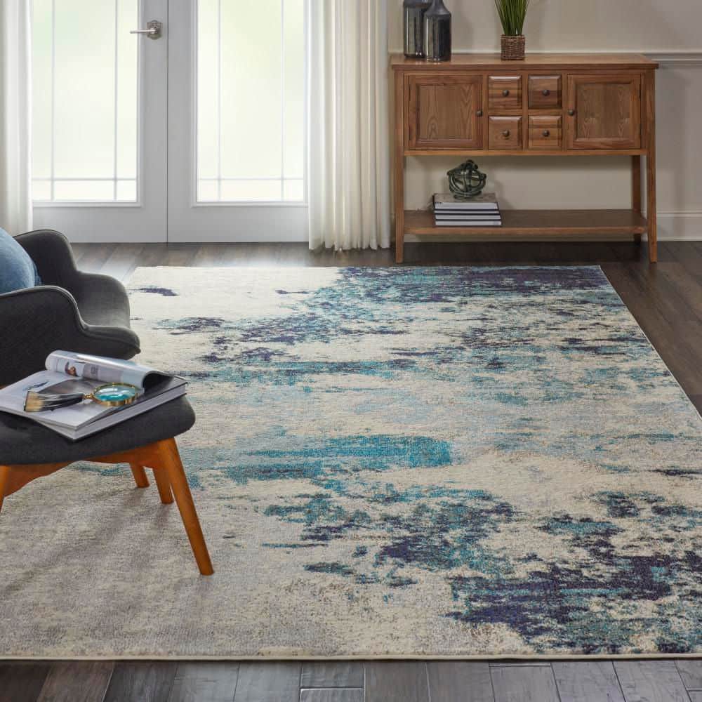 Ivory and Teal Blue Abstract 6' x 9' Synthetic Area Rug