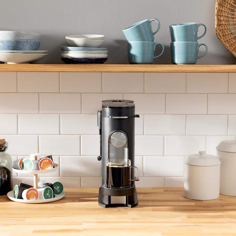 Black Single-Serve Coffee Maker with Integrated Milk Frother