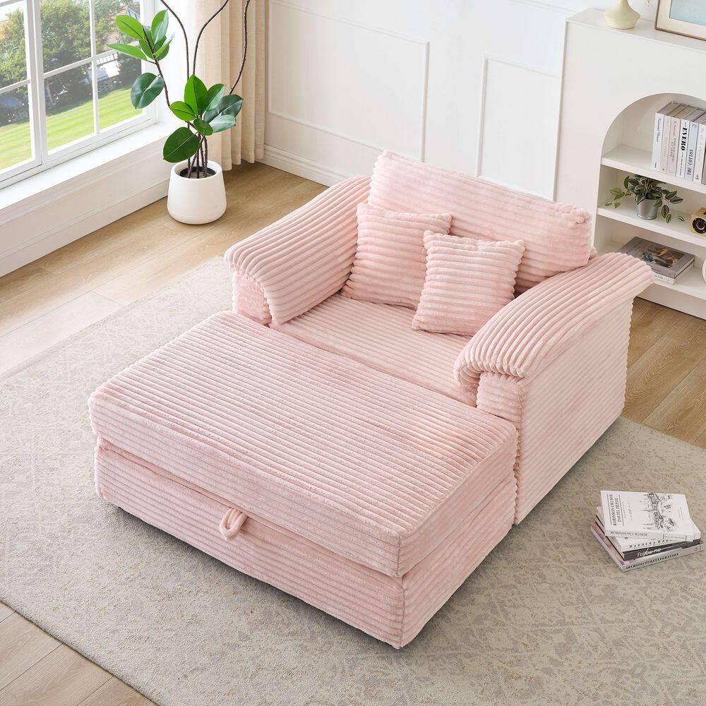 Pink corduroy sofa in a bright living room setting.