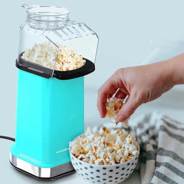https://images.thdstatic.com/productImages/8ef966d1-7aea-4460-b893-d6371e3fcbe2/svn/turquoise-ovente-popcorn-machines-pm11t-31_600.jpg