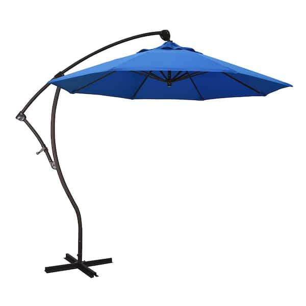 California Umbrella 9 ft. Bronze Aluminum Cantilever Patio Umbrella with Crank Open 360 Rotation in Royal Blue Olefin