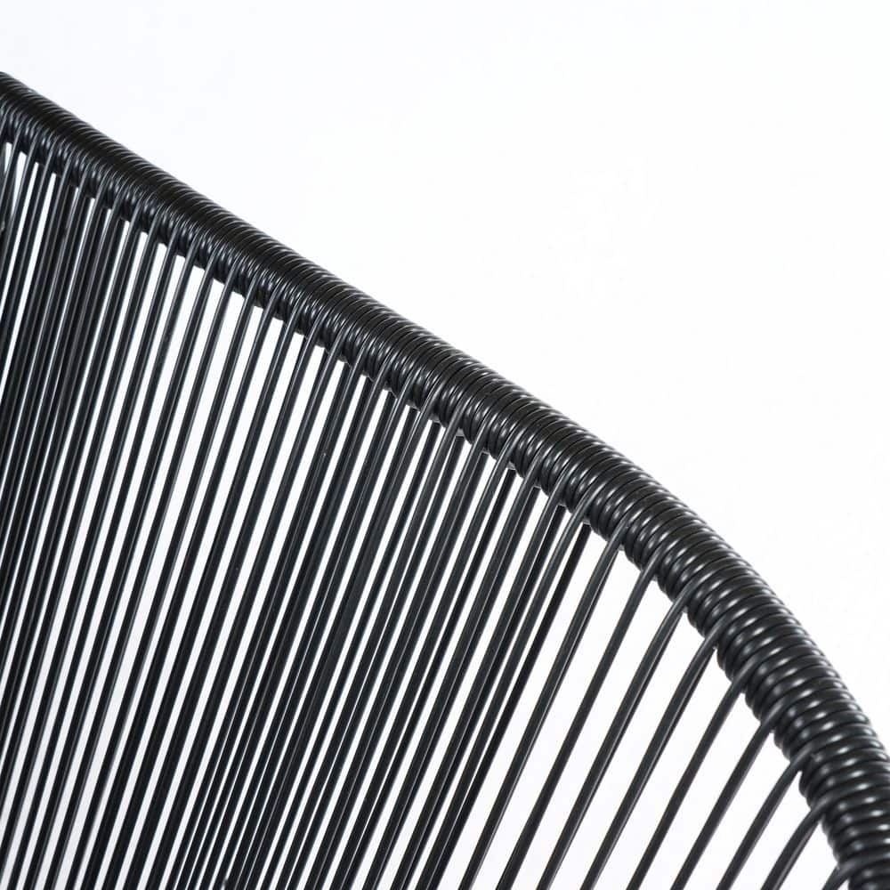 Close-up of the black faux rattan texture on a patio bench.