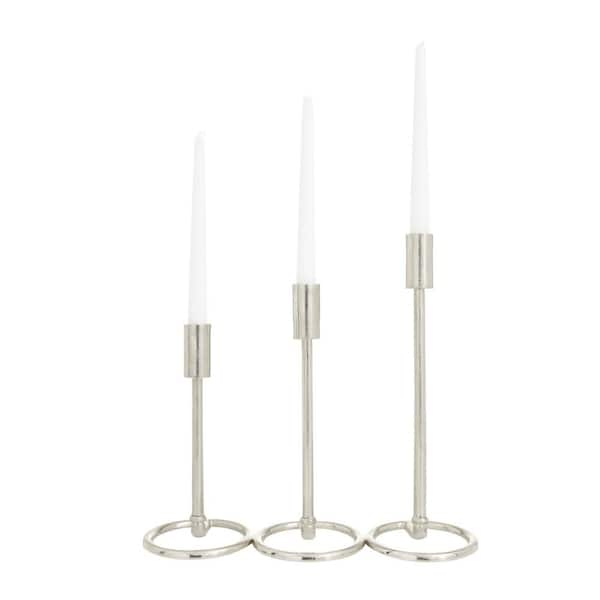 https://images.thdstatic.com/productImages/8f917238-27c4-5d25-aea4-6d03e5a9e3cf/svn/silver-litton-lane-candle-holders-040896-64_600.jpg