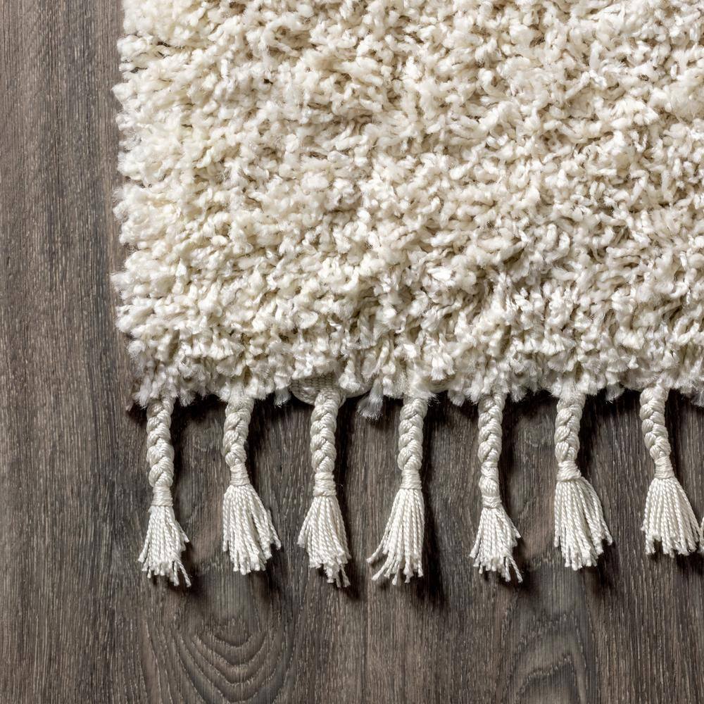 Cream 2 x 8 Shag Reversible Synthetic Area Rug with Tassels