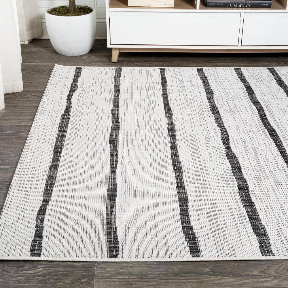 Ivory and Black Striped Synthetic 4' x 6' Indoor/Outdoor Rug