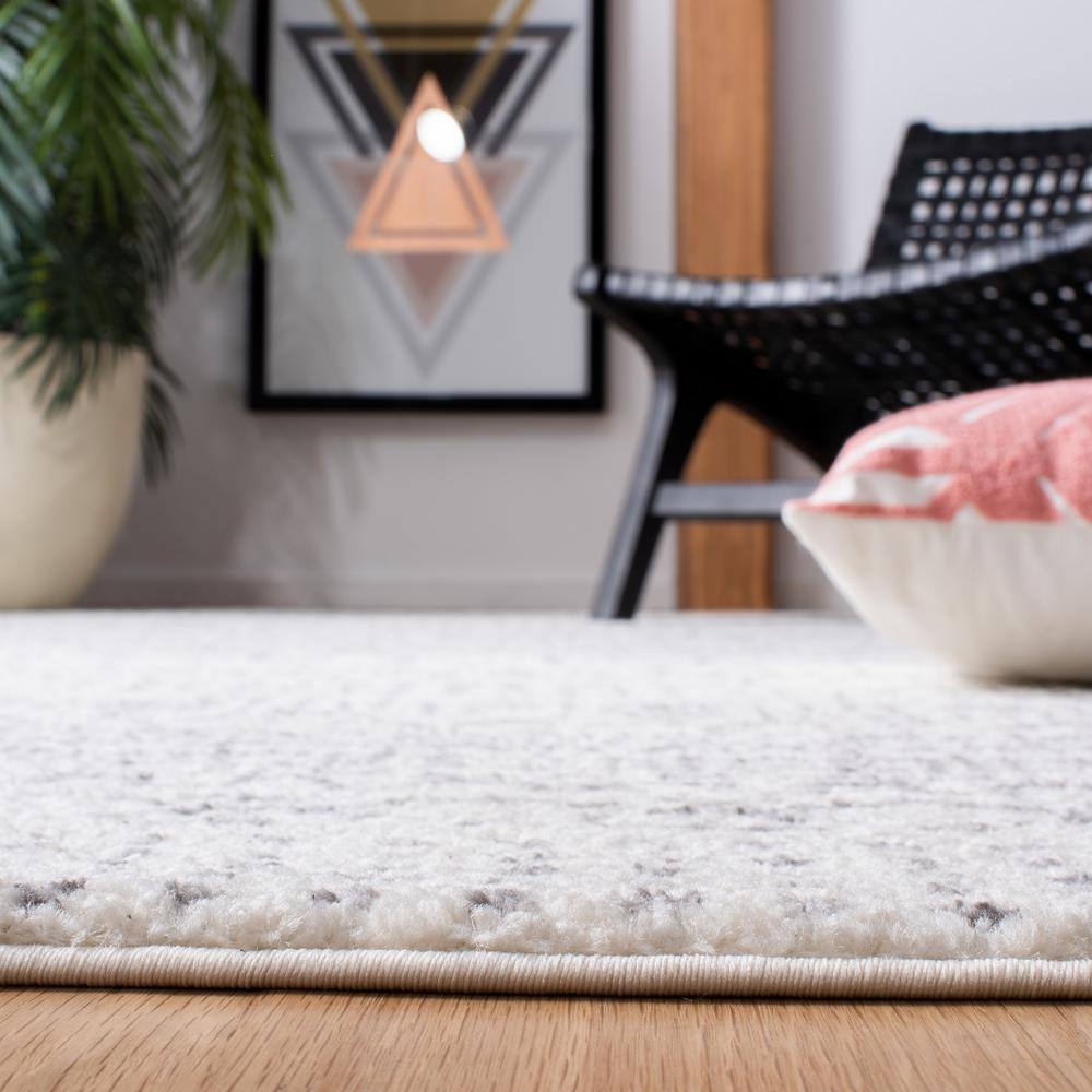 Ivory and Blue Geometric Round Synthetic Area Rug, 6' x 9'