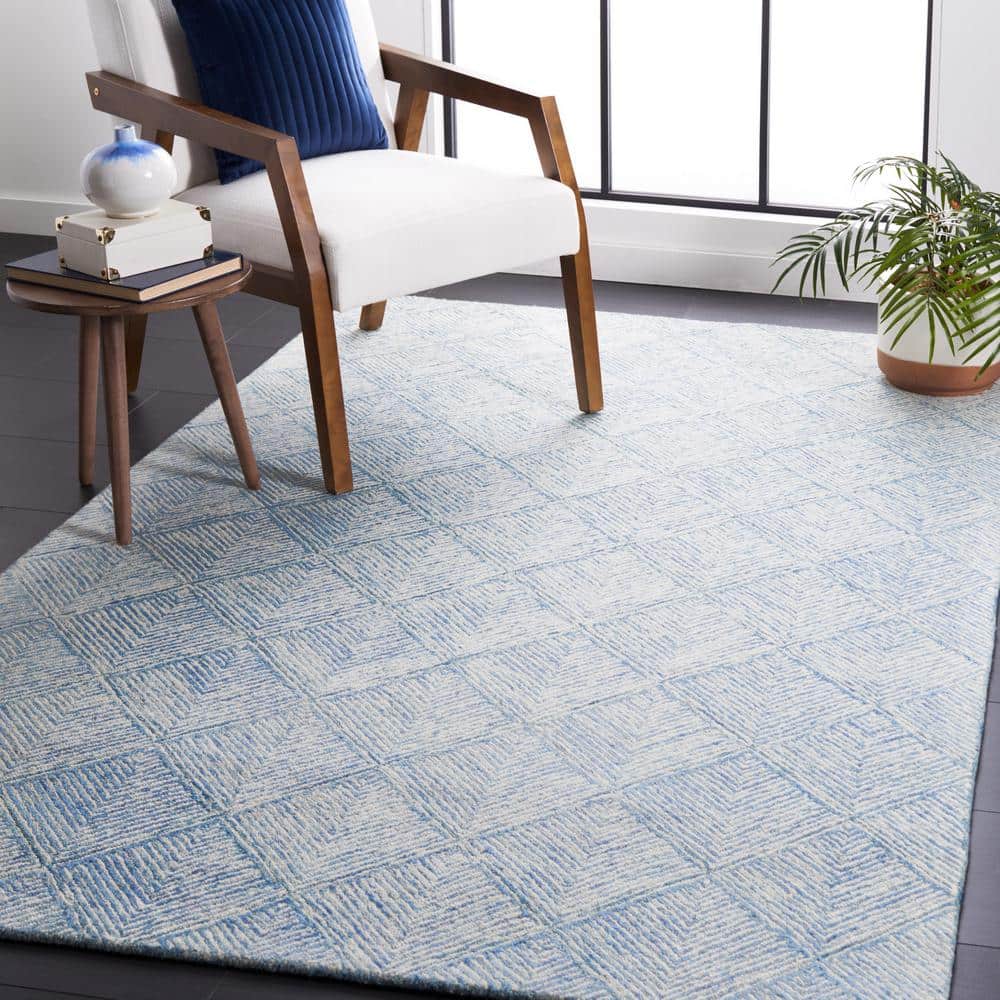 Handmade Blue and Ivory Wool Abstract Tufted Area Rug 5' x 8'