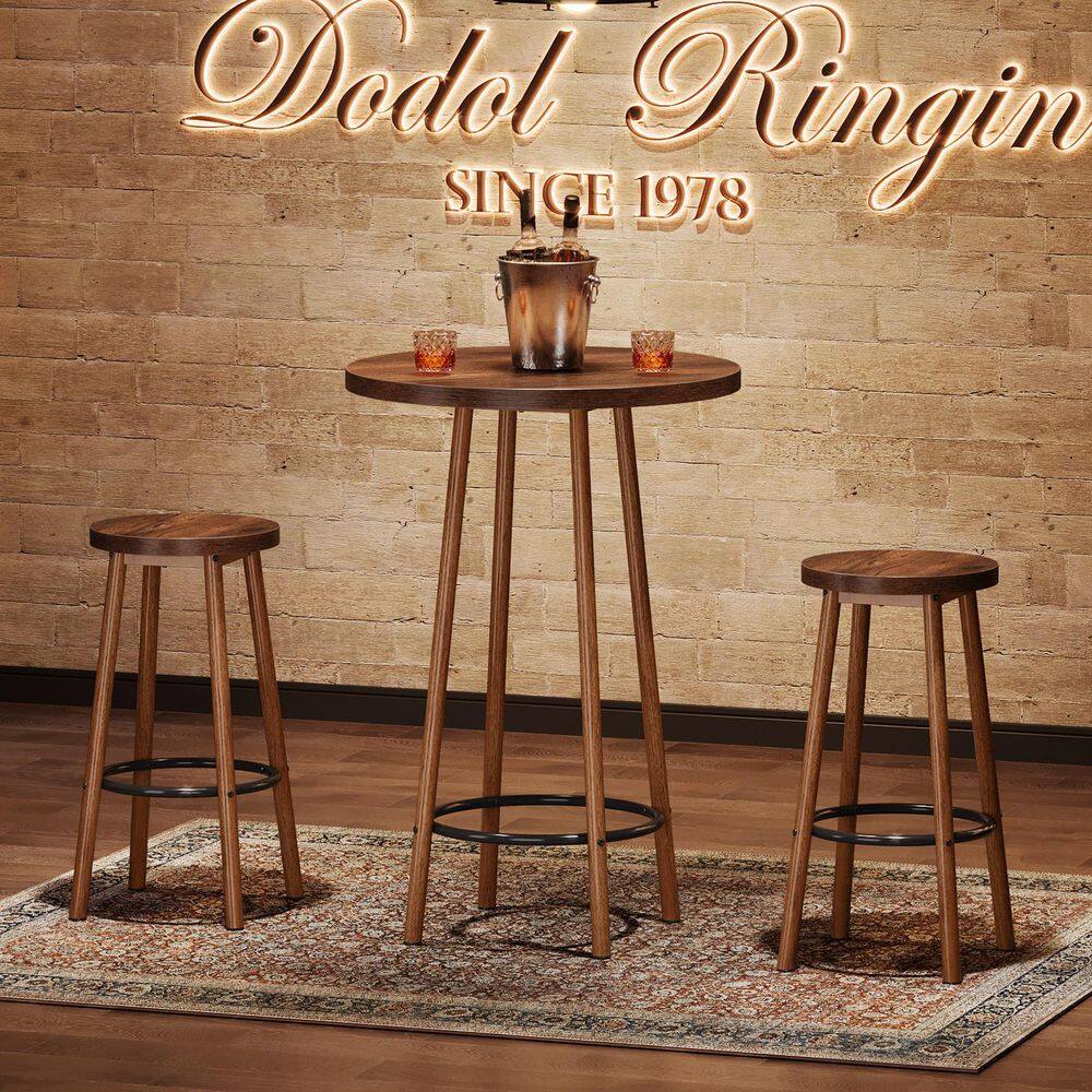 Brown bar table with an ice bucket and glasses.