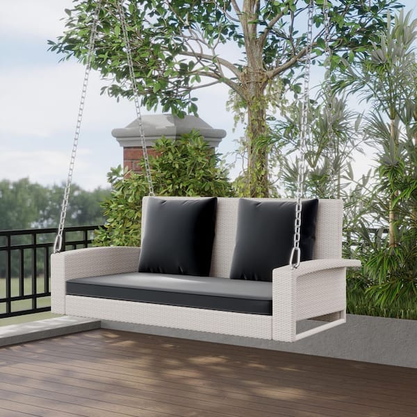 2-Person White Wicker Porch Swing with Gray Cushion and Pillows