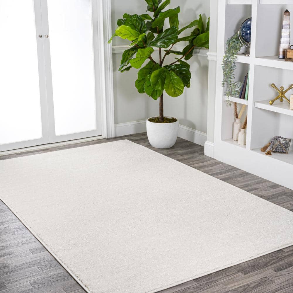 Cream Solid Synthetic Reversible 10' x 14' Area Rug