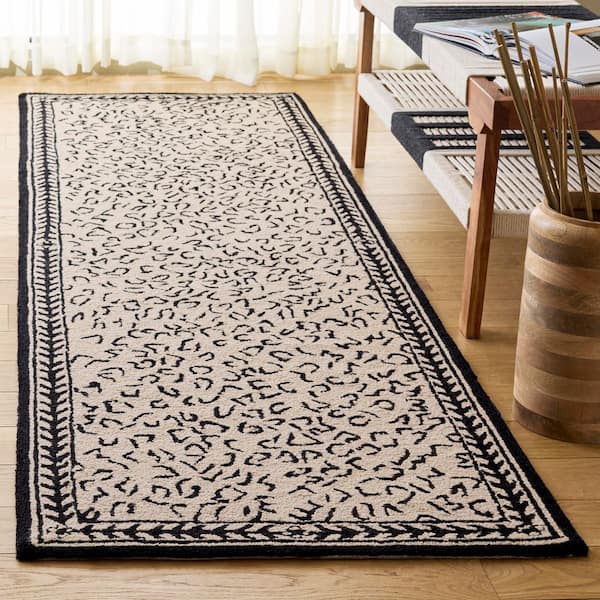 Chelsea 3 ft. x 14 ft. White/Black Border Animal Print Runner Rug