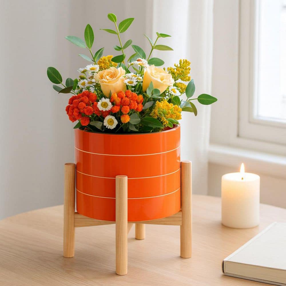 Liv & Skye Orange Ceramic Planter (8 in. W x 6 in. H) with Wood