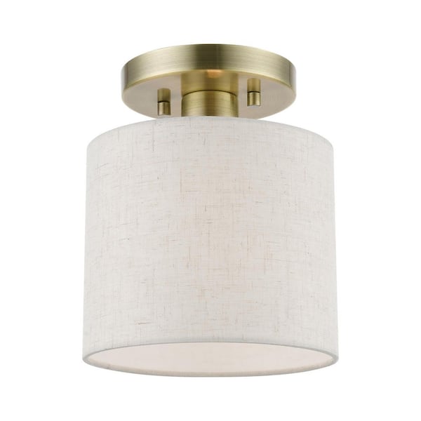 Livex Lighting Blossom 7 in. 1-Light Antique Brass Petite Semi-Flush Mount with Oatmeal Color Fabric Shade