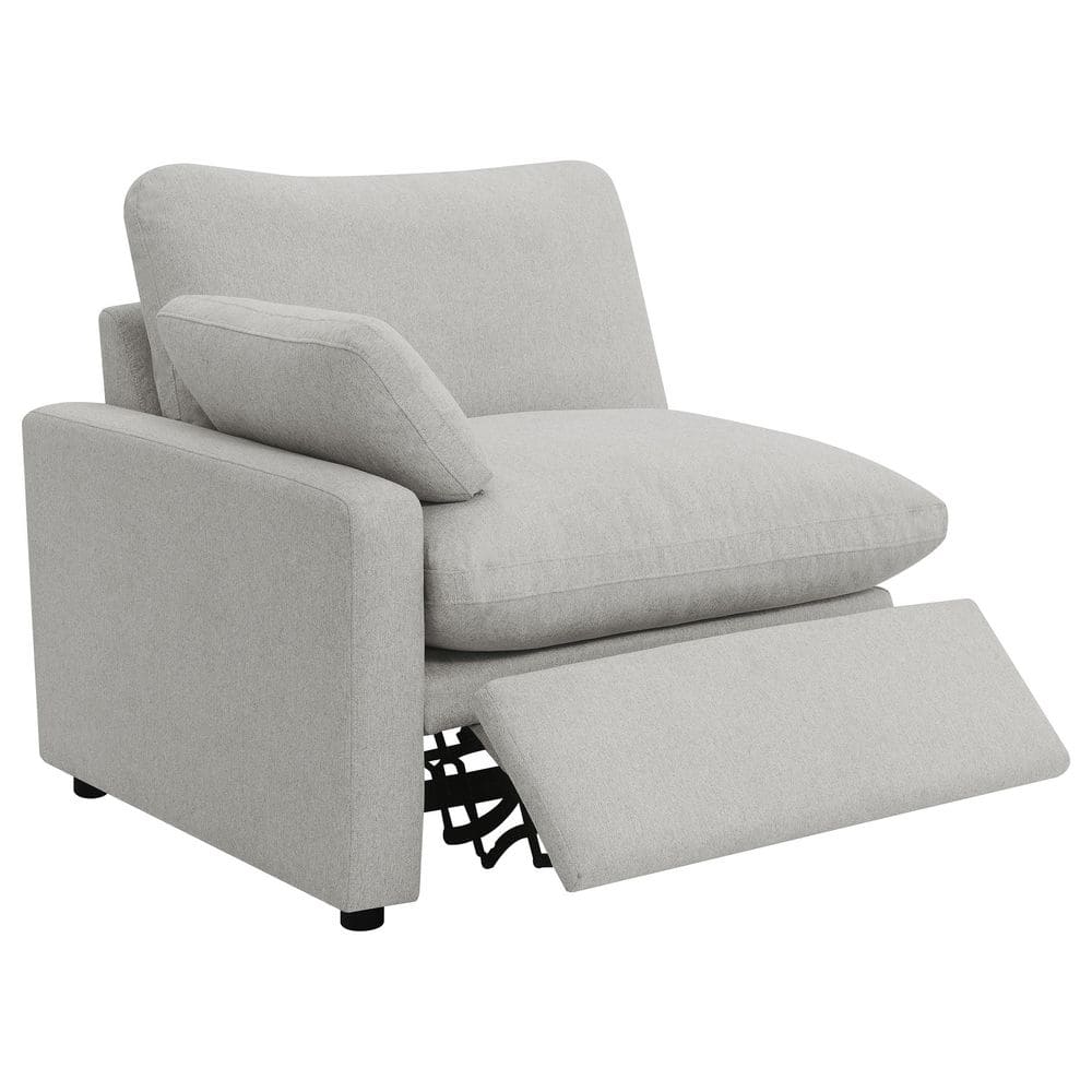 Single module of a grey fabric upholstered modular power recliner with footrest extended.
