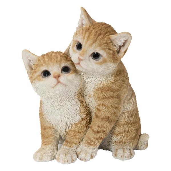 Kittens Hugging Orange Statues