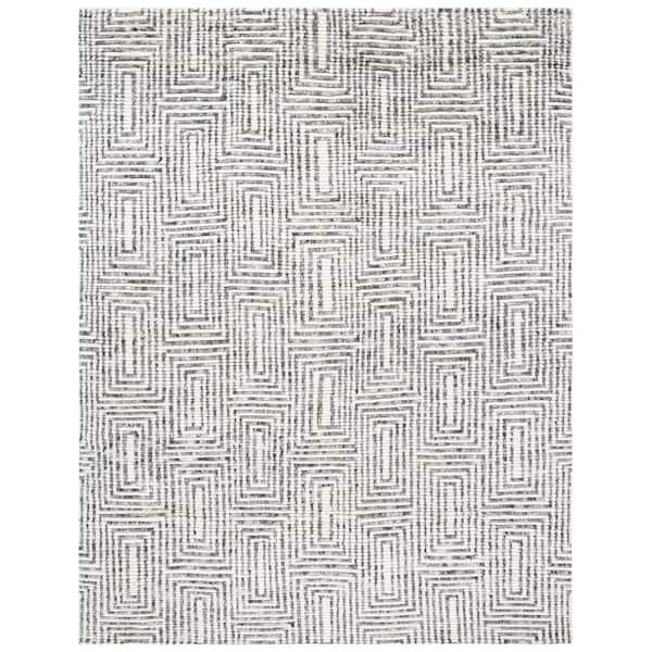 Tibetan 8 ft. x 10 ft. Black/Ivory Geometric Area Rug