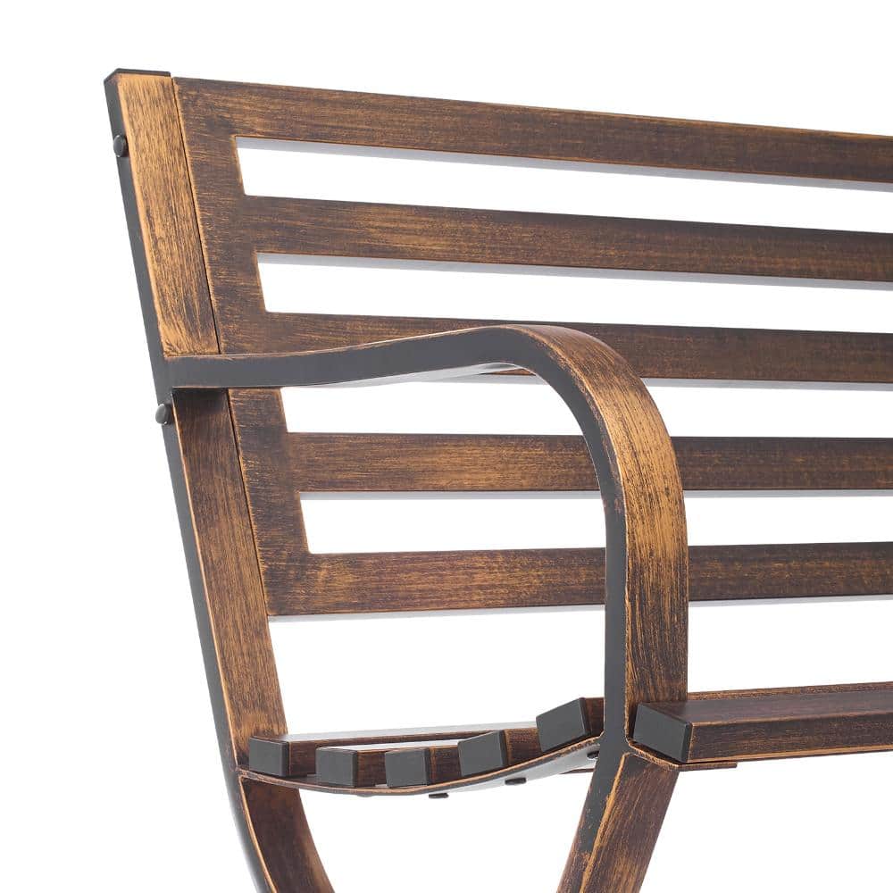 Close-up view of the slatted backrest and curved armrest of the metal bench.