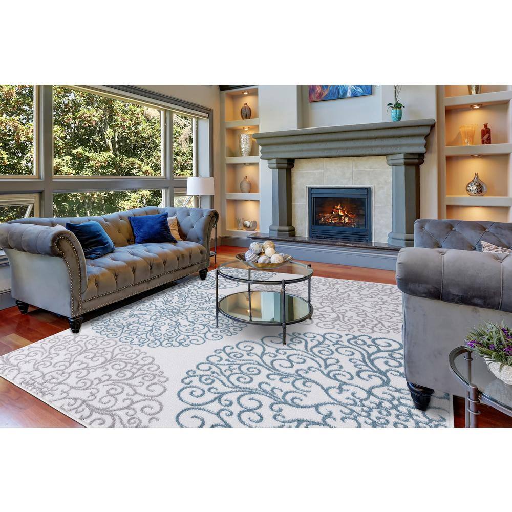 Ivory Elegance 5'3" x 7'3" Synthetic Medallion Area Rug