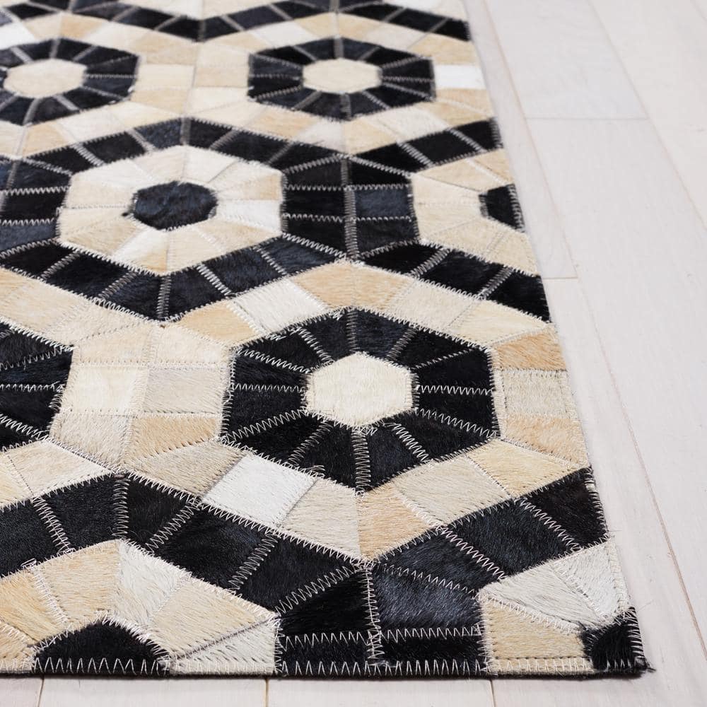 Handmade Black and Beige Geometric Cowhide Area Rug