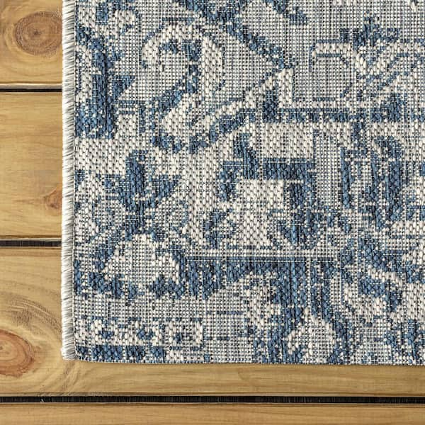 https://images.thdstatic.com/productImages/917b4b2d-b891-4516-9246-f39a5ed9e74b/svn/navy-gray-jonathan-y-outdoor-rugs-smb105b-9-1f_600.jpg