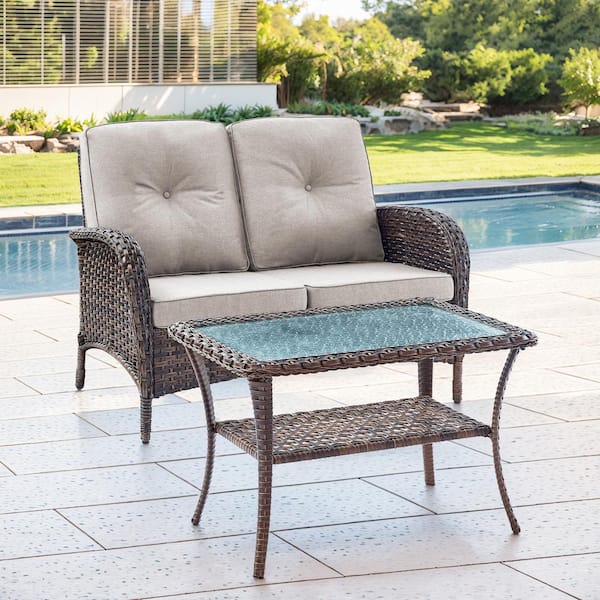 SleekArm 2-Piece Brown Wicker Outdoor Loveseat with Beige Cushions and Coffee Table