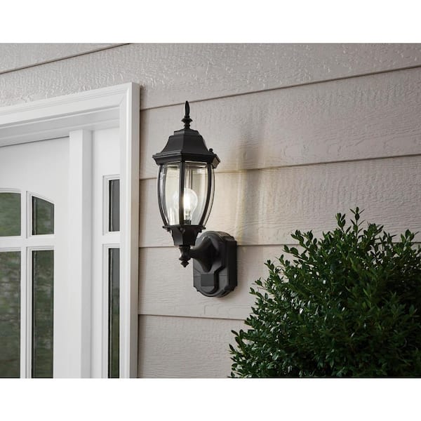 Alexandria 17.3 in. 1-Light Farmhouse Matte Black Motion Sensing, Dusk-to-Dawn, Outdoor Wall Light Lantern Sconce