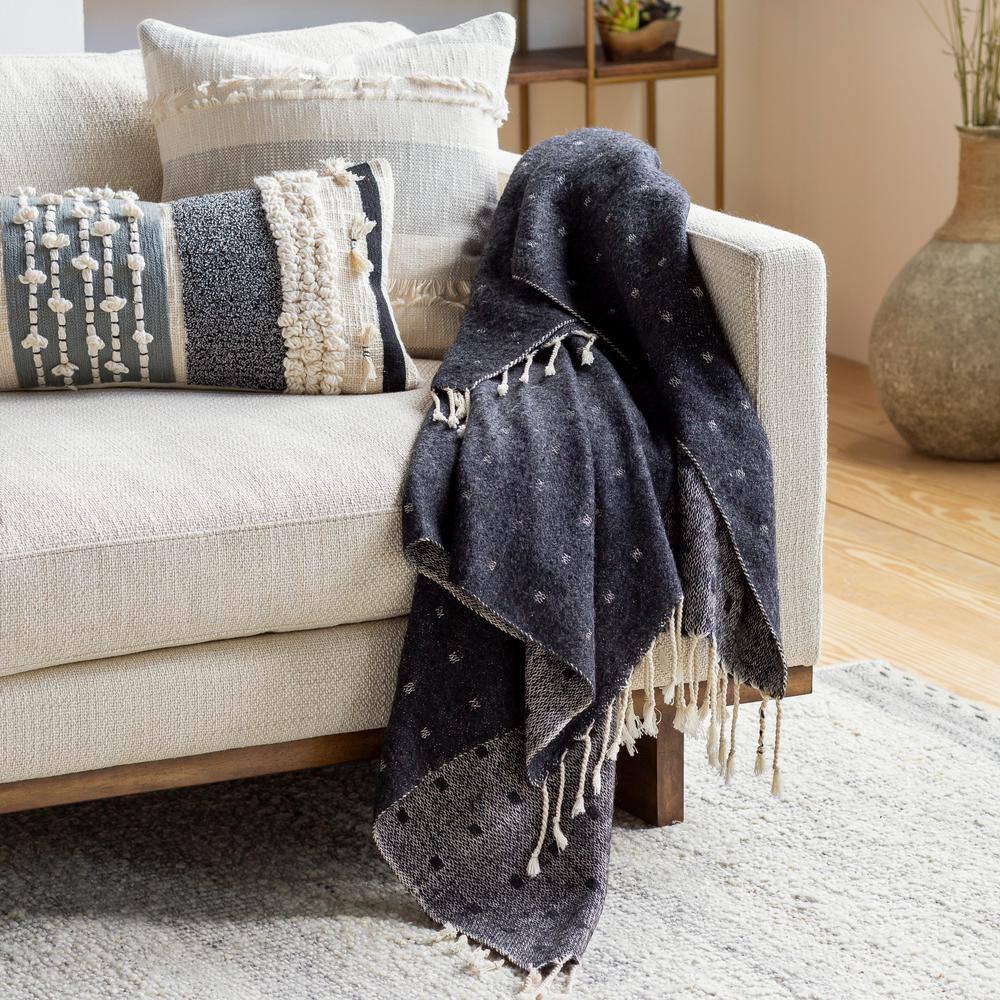 Small black throw blanket.