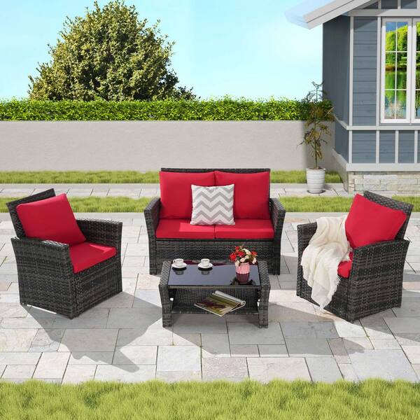 Zeus & Ruta 4-Piece Gray Wicker Outdoor Patio Conversation Set with Red Cushions and Tempered Glass Coffee Table