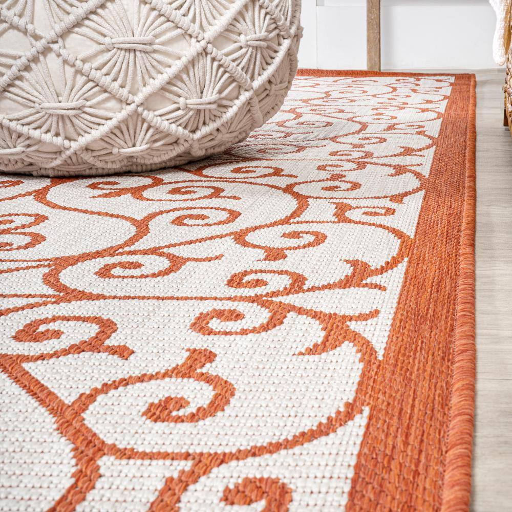 Cream and Orange 8' x 10' Synthetic Flat Woven Reversible Rug