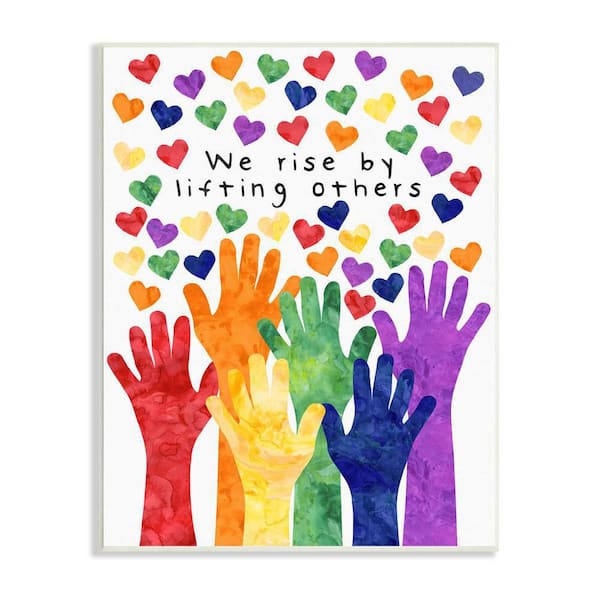 The Stupell Home Decor Collection We Rise by Lifting Others Rainbow Hand Hearts by Erica Billups Unframed Typography Art Print 19 in. x 13 in.