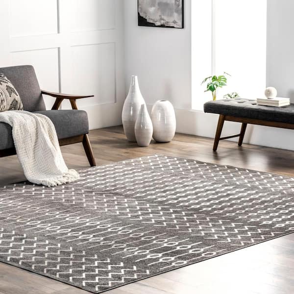 https://images.thdstatic.com/productImages/91f75679-3d60-5369-a148-a6ba18f7628d/svn/gray-nuloom-area-rugs-lpkv04a-8010-e1_600.jpg