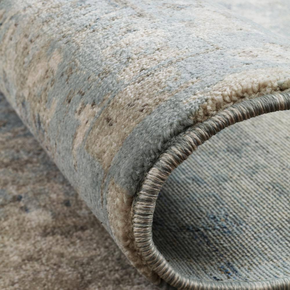 Handmade Blue and Ivory Abstract Synthetic Area Rug, 2' x 3'