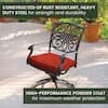 Single outdoor swivel rocker chair with red cushion.
