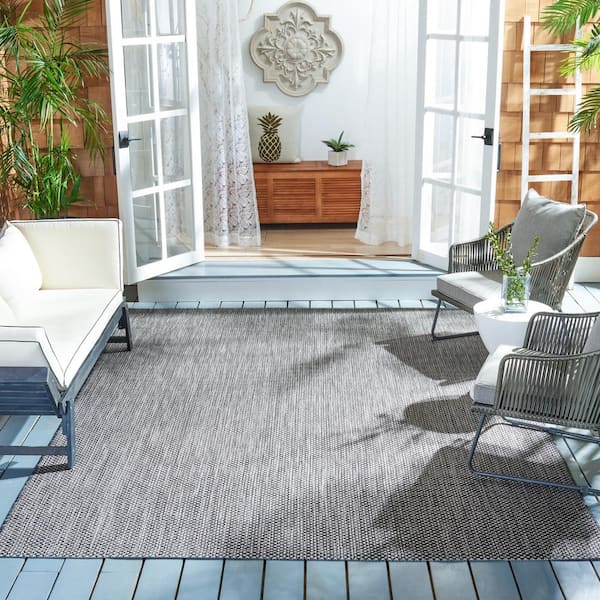 https://images.thdstatic.com/productImages/921575af-0794-47dc-bf4a-033c823fe8a3/svn/black-beige-safavieh-outdoor-rugs-cy8521-36621-810-e1_600.jpg