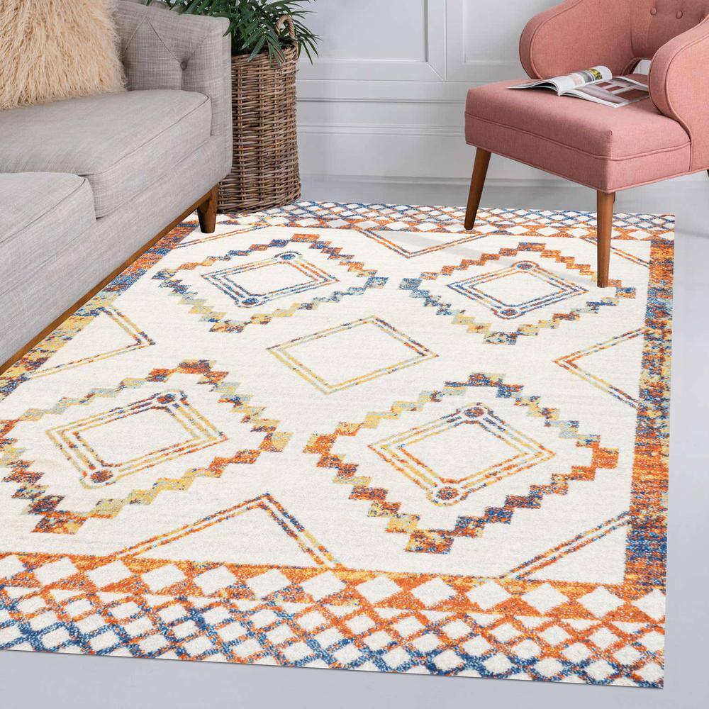 Ivory and Blue Geometric 8' x 10' Synthetic Area Rug