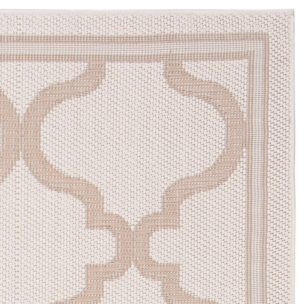 Ivory and Beige Geometric 8' x 10' Synthetic Area Rug