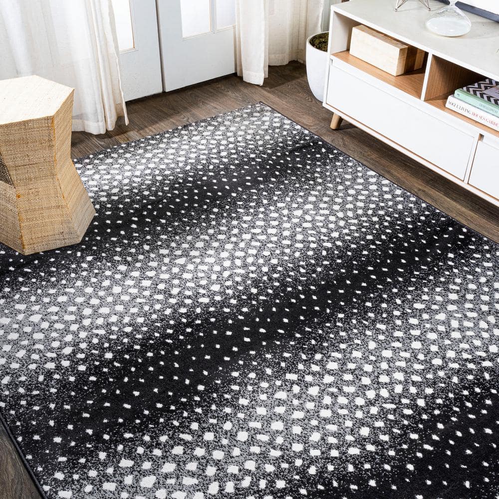 Abstract Antelope 8' x 10' Black and Ivory Synthetic Area Rug