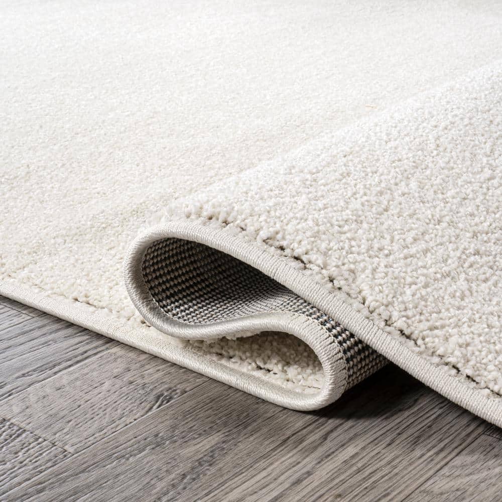 Cream Solid Synthetic Reversible 10' x 14' Area Rug