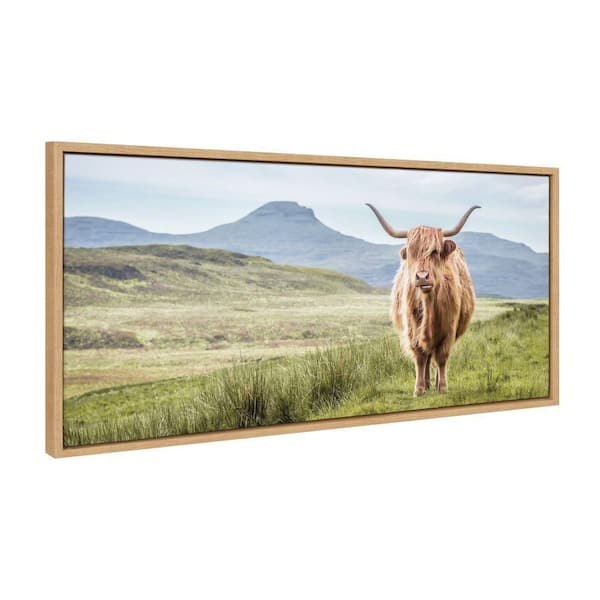 Kate and Laurel Sylvie Highland Cow Mountain Landscape by The Creative Bunch Studio Framed Art Print 18 in. x 40 in.