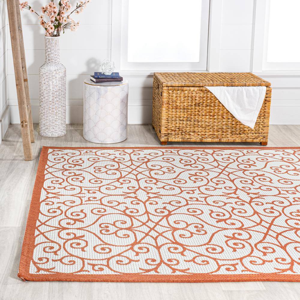 Cream and Orange 8' x 10' Synthetic Flat Woven Reversible Rug
