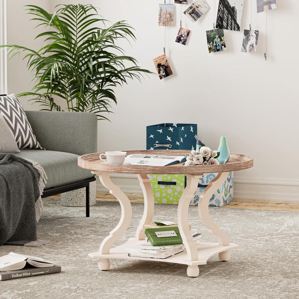 Round wood coffee table with shelf in a styled room.