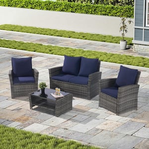 4-Piece Wicker Outdoor Patio Conversation Set with Thick Dark Blue Cushion and Tempered Glass Coffee Table