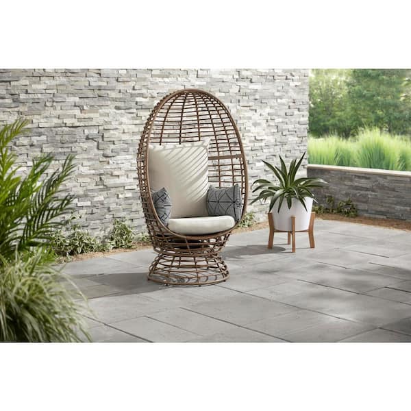 StyleWell Brown Wicker Outdoor Swivel Patio Egg Lounge Chair with Beige Cushions and Black/Cream Pattern Pillows