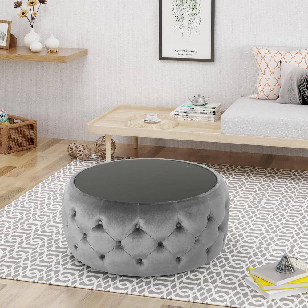 Elegant Round Glass-Top Velvet Ottoman Coffee Table