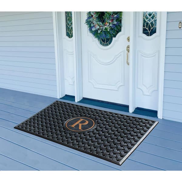 https://images.thdstatic.com/productImages/93a8f1f9-8147-40d2-95ee-11489f22e89f/svn/black-a1-home-collections-door-mats-a1home200174-r-40_600.jpg