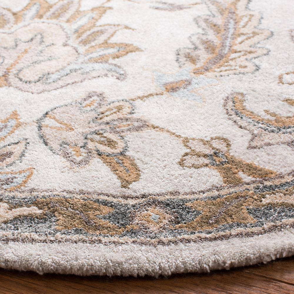 Handmade Ivory Floral Tufted Wool Round Rug, 5' x 5'