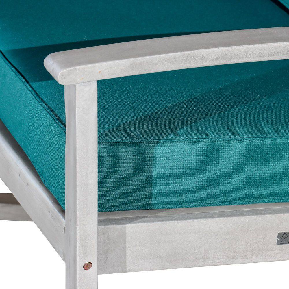 Close-up detail of the wooden frame and green cushion of the chair.