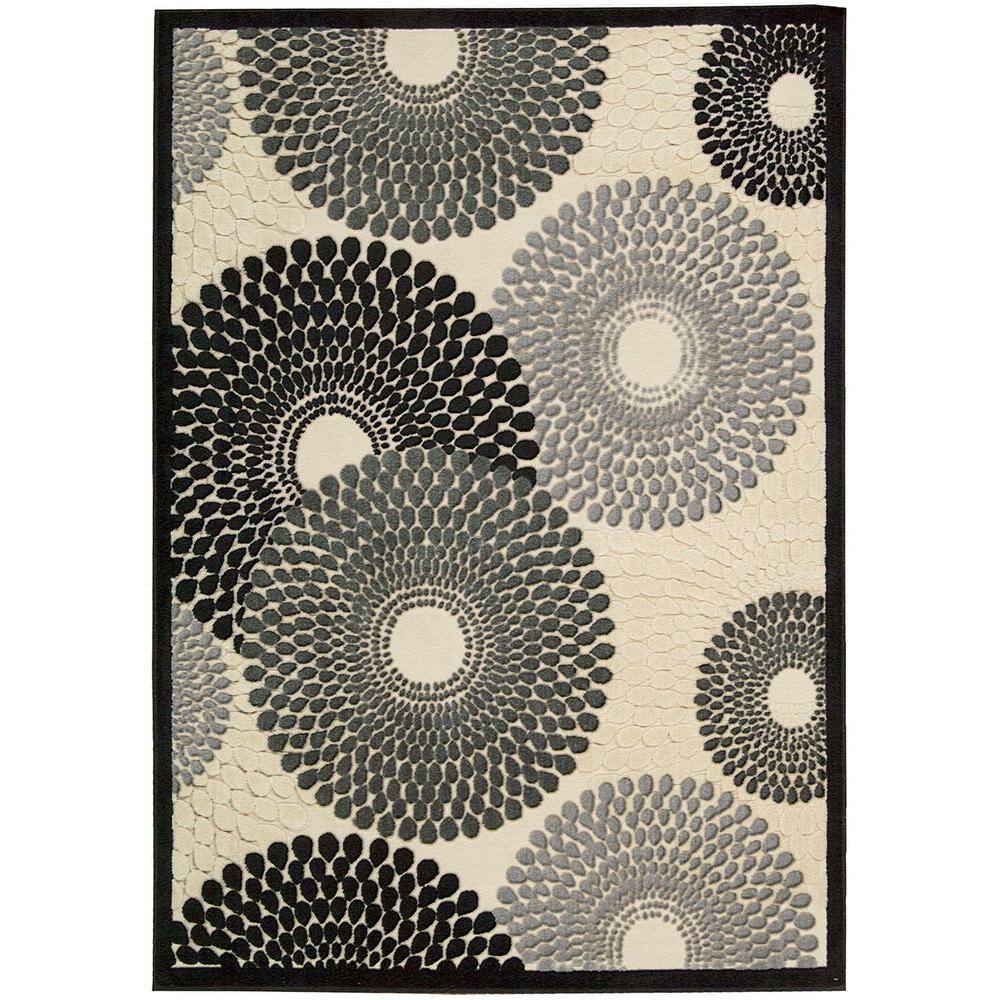 Nourison Graphic Illusions Parchment 5 ft. x 7 ft. Geometric Modern Area Rug The Nourison Graphic Illusions 5 ft. x 7 ft. Area Rug is a great option when looking to enhance your home decor. This rug has stain-resistant fabrics, which keep it free of blemishes. It is designed with white elements, bringing a subtle and pure touch to any room. With its repetitive geometric pattern, this loomed rug will achieve a modern look with crisp, clean lines. It has a 70% acrylic design, which adds style and comfort. Color: Parchment.