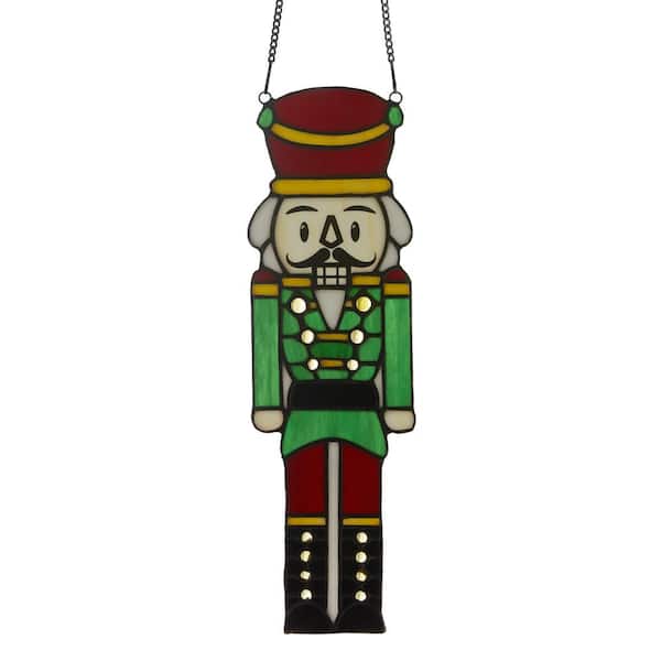 River of Goods Fritz 14 in. Red and Green Holiday Nutcracker Stained Glass Window Panel