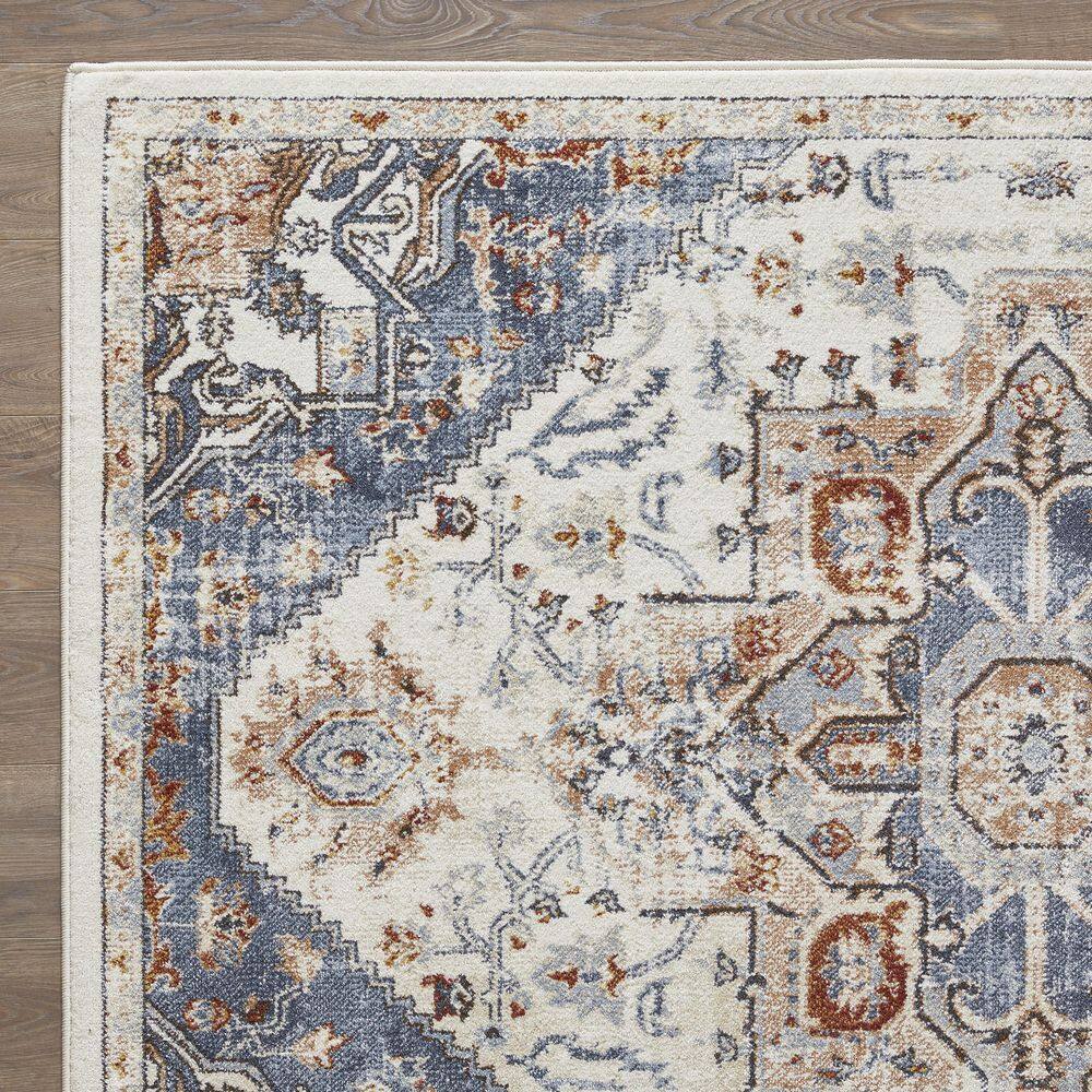 Cream and Blue 6' x 9' Synthetic Oriental Area Rug